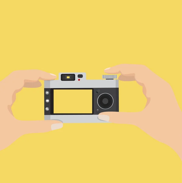 Hands holding vintage camera — Stock Vector