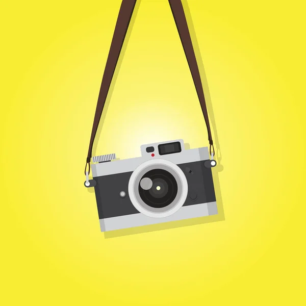 Hanging vintage camera over yellow background — Stock Vector