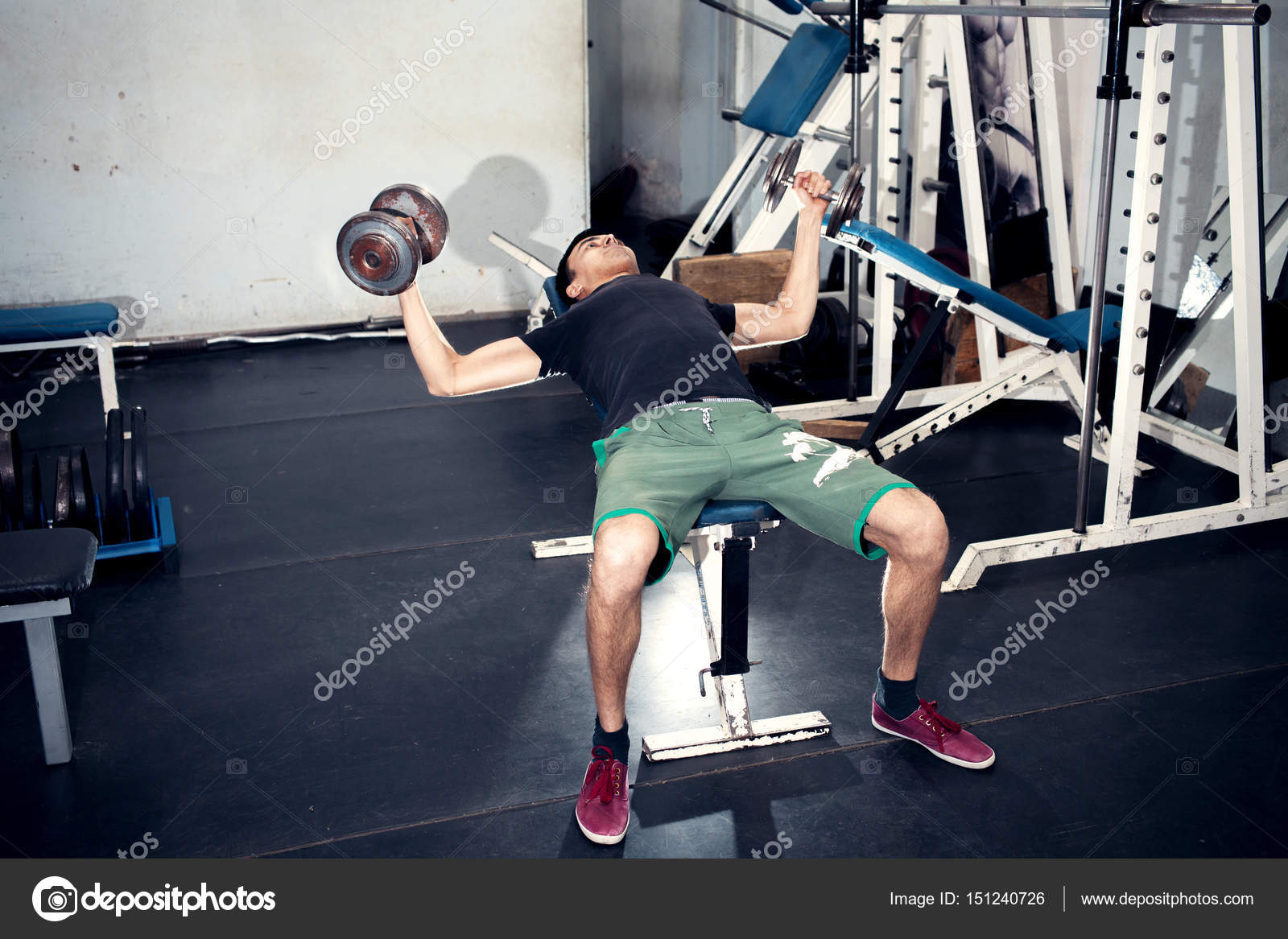 Exercise With Dumbbells Wiring In The Sides On An Incline Bench