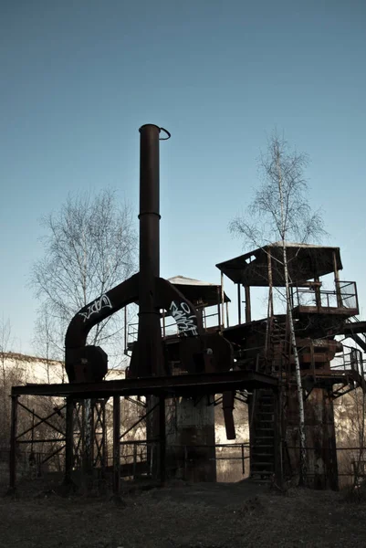 Old abandoned quarry, rusty silos — Stock Photo, Image