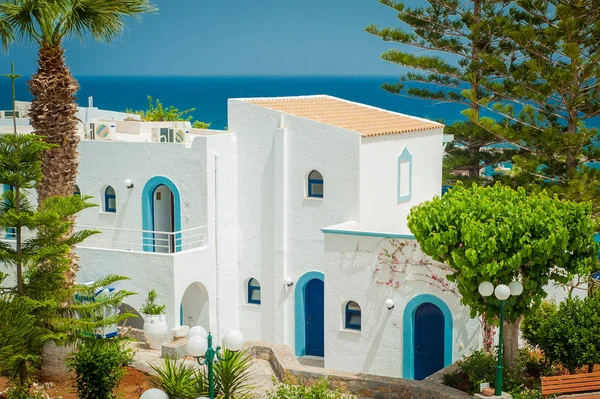 Greek architecture - white buildings, sea and blue windows, Boug