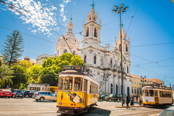 Yellow tram 28 on streets of Lisbon, Portugal