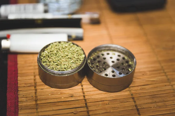 Marijuana flower in metal grinder — Stock Photo, Image