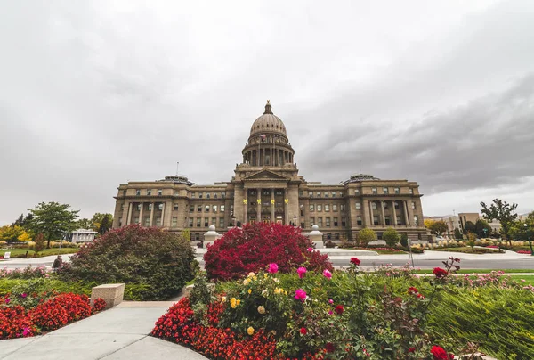 Flowers bloom in front of the Idaho State Capitol Building in Boise, Idaho, USA.