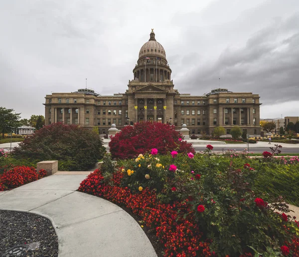 Flowers bloom in front of the Idaho State Capitol Building in Boise, Idaho, USA.