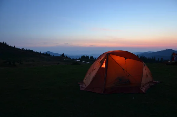 hiking tent in mountains night
