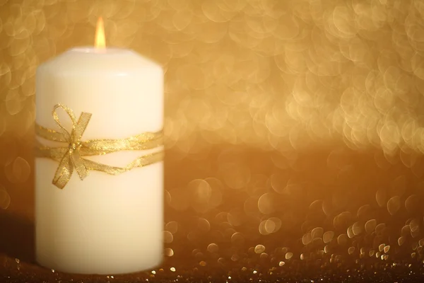 Christmas candle on shiny background — Stock Photo, Image