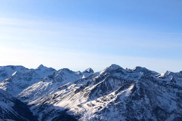 Tops of winter alp mountains at sunny day — Stock Photo, Image