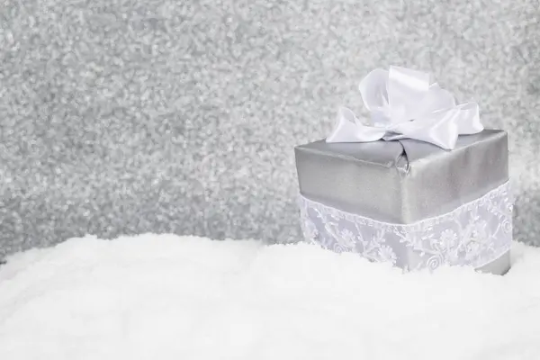 Christmas gift in snow — Stock Photo, Image