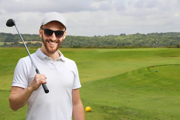 Golfista com clube de golfe — Fotografia de Stock