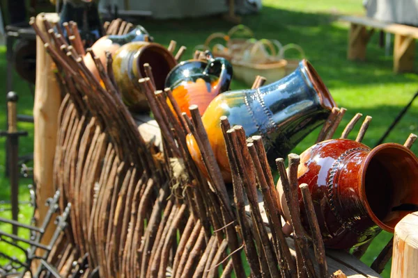 Clay jugs on the fence — Stock Photo, Image