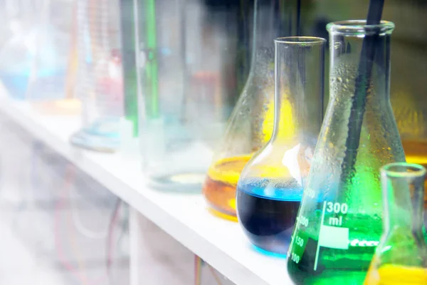 Laboratory glassware with liquids — Stock Photo, Image