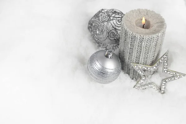 Christmas candle in snow — Stock Photo, Image