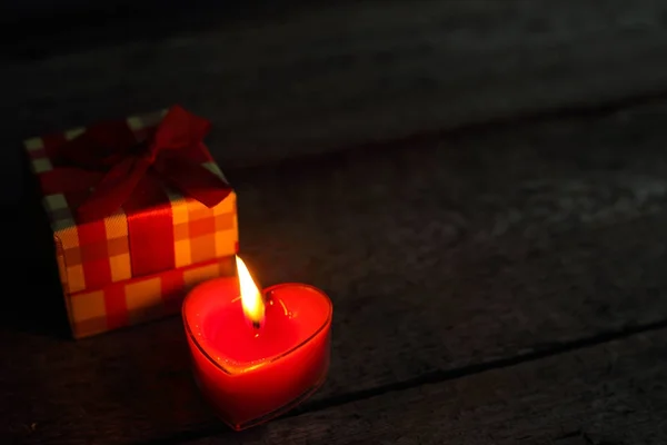 Heart shaped candle burning — Stock Photo, Image