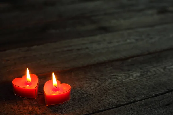 Heart shaped candles burning — Stock Photo, Image