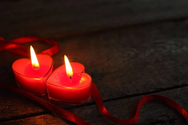 Heart shaped candles burning — Stock Photo, Image