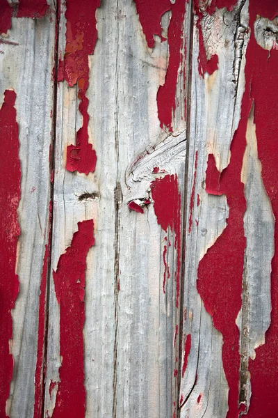 Textura de pintura de descascamento vermelho na parede — Fotografia de Stock