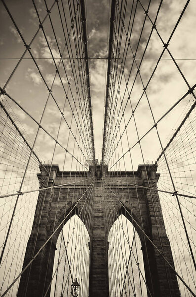 Brooklyn bridge in New York is one of the oldest bridges of either type in the United States. Completed in 1883. Picture in sepia