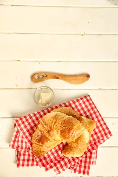 Croissant on a wooden cutboard — Stock Photo, Image