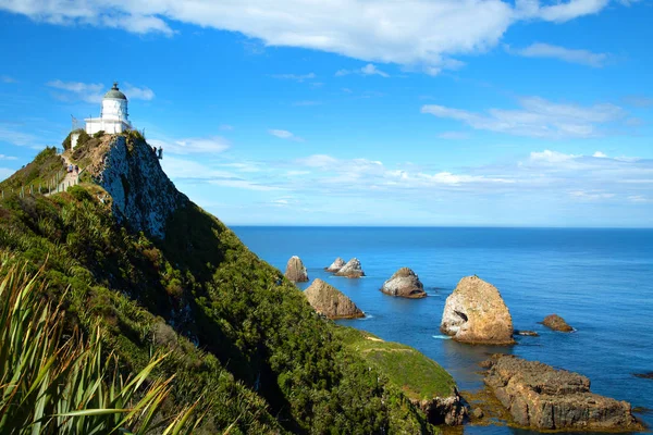 Lighthouse at point nugget in New Zealand — Stock Photo, Image