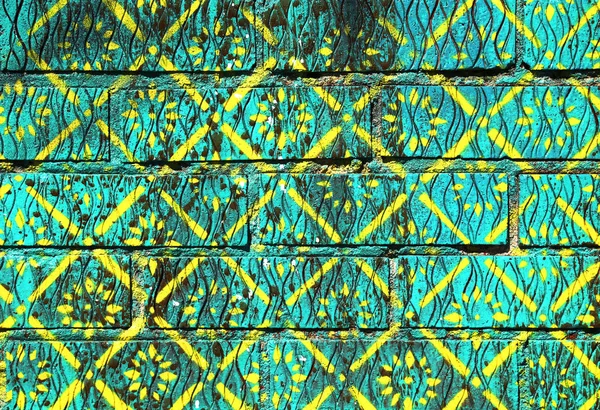 Grön och gul mönstrad färg peint tegelvägg — Stockfoto