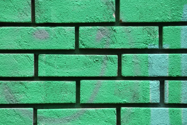 Green peint brick wall