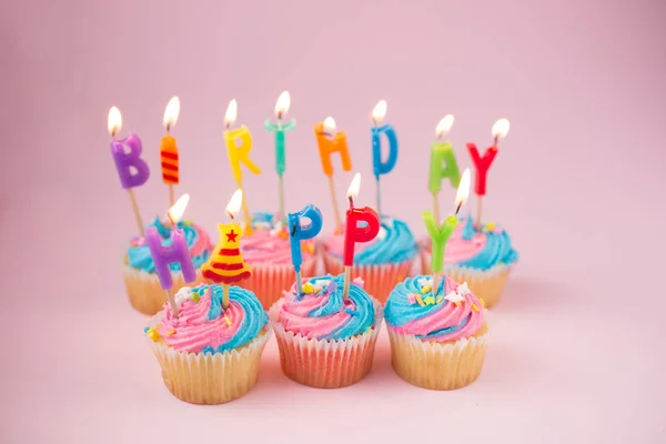 Happy birthday cupcakes with candles — Stock Photo, Image