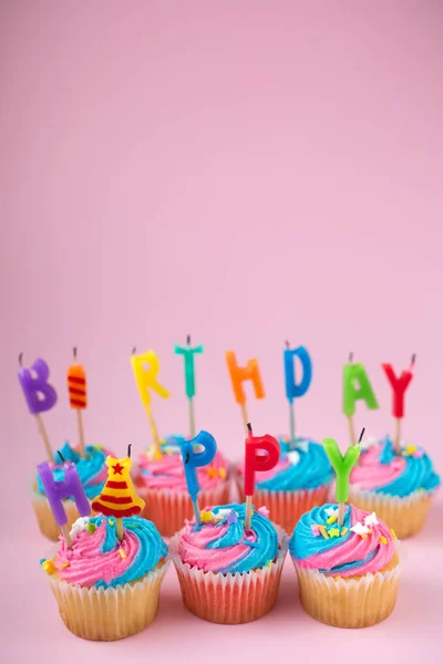 Happy birthday cupcakes with candles — Stock Photo, Image