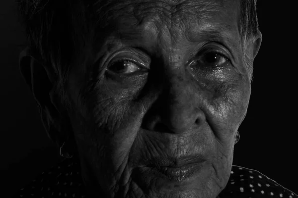 Lonely senior woman  portrait sad depressed,emotion, feelings, thoughtful, senior, old woman,wait, gloomy, worried, covering her face, Human face expressions, isolated black background — Stock Photo, Image