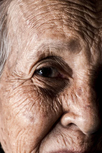 Lonely senior woman smiling in camera — Stock Photo, Image