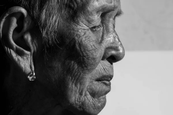 Lonely senior woman portrait sad depressed, emotion, feelings, thoughtful, senior, old woman, wait, gloomy, concerned, covering her face, Human face expressions — Fotografia de Stock