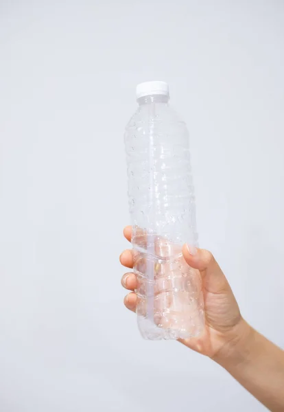 stock image Plastic bottles in black garbage bags waiting to be taken to recycle.