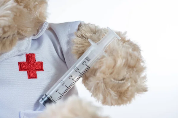 Red Cross, hypodermic needle(injection needle) on white background.