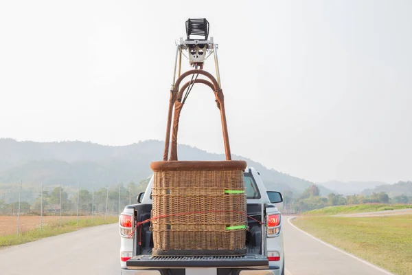 Car ride with the hot air balloon basket prepare to fire up