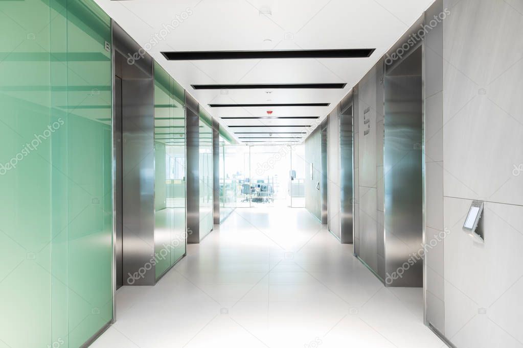 Empty hallway having elevator of business building 