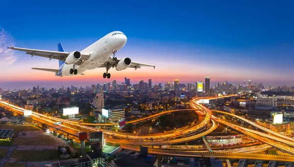 Airplane take off over the panorama city at twilight scene