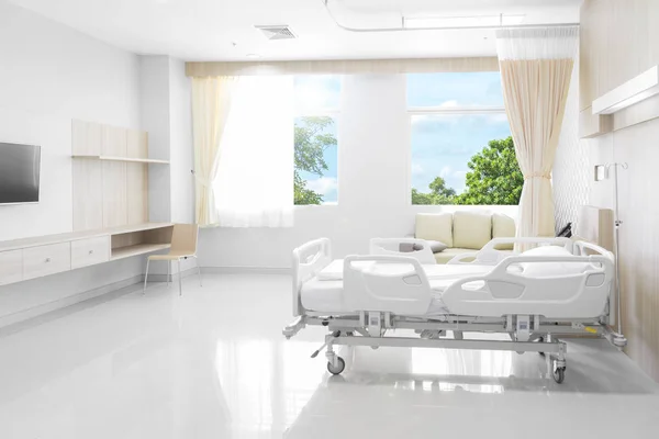 Hospital room with beds and comfortable medical equipped with natural background