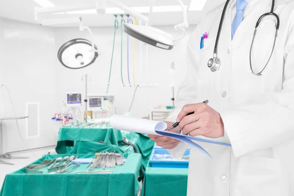 Doctor writing a medical prescription with medical background — Stock Photo, Image