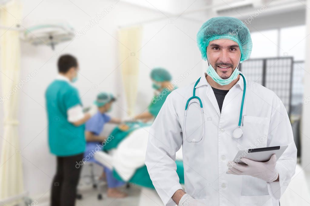 Doctor using digital tablet in operating room