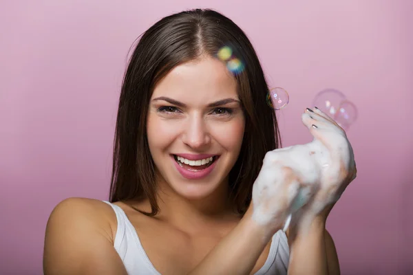 Beautiful young woman washing up her face — Stock Photo, Image