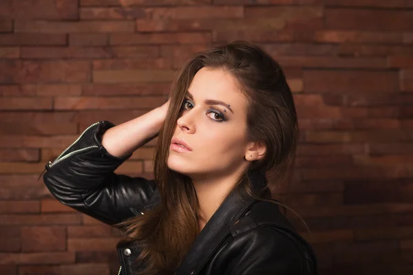 Stylish woman with leather jacket