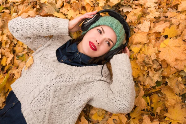 Woman in the autumn leaves Royalty Free Stock Photos