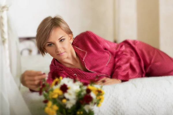 Woman in her bedroom — Stock Photo, Image