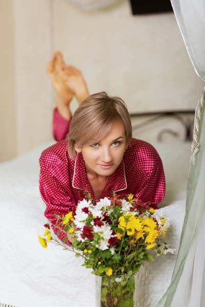 Woman in her bedroom — Stock Photo, Image