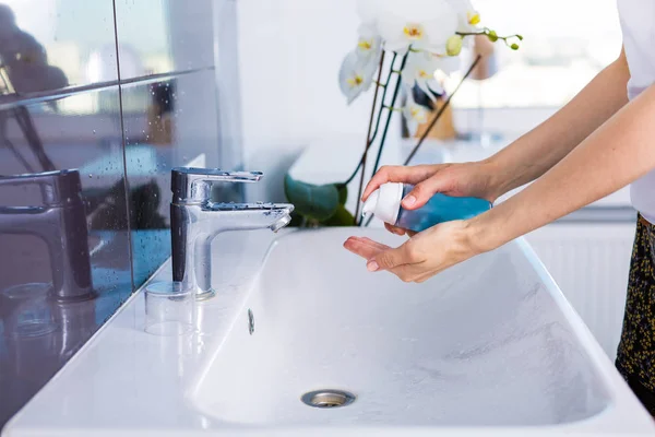 Woman washing up in the morning