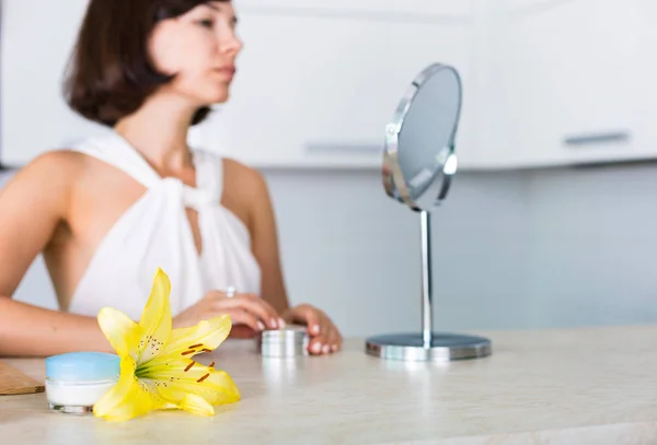 Essential cosmetics on a table — Stock Photo, Image