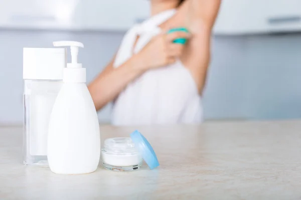 Essential cosmetics on a table — Stock Photo, Image