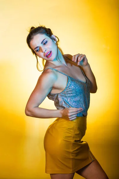 Beautiful woman posing in disco lights — Stock Photo, Image