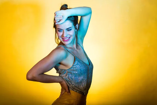 Beautiful woman posing in disco lights — Stock Photo, Image