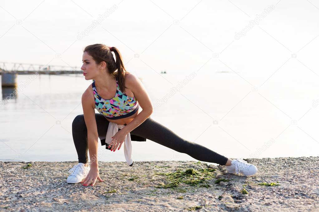 Woman working out on the beach